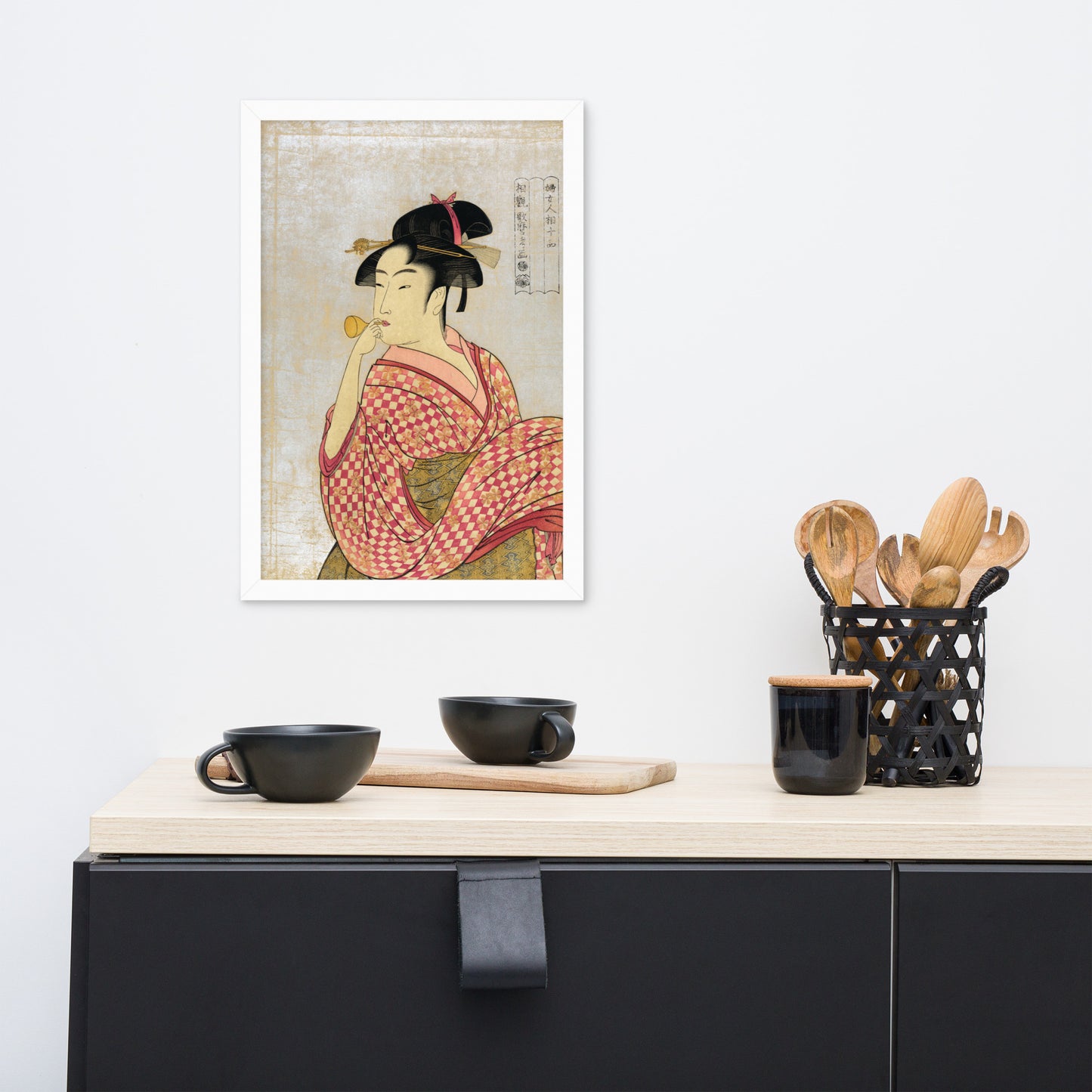 Young Lady Blowing on a Poppin by Kitagawa Utamaro